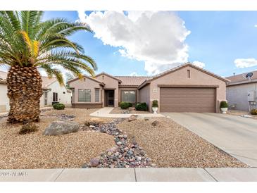 Single-story home with desert landscaping and two-car garage at 15253 W Pasadena Dr, Surprise, AZ 85374