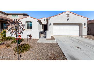 Single-story home with attached garage and desert landscaping at 18254 W Via Montoya Dr, Surprise, AZ 85387