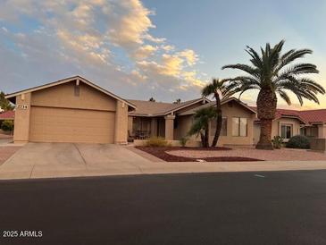 Single-story home with attached garage and desert landscaping at 2734 Leisure World --, Mesa, AZ 85206