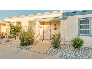 Attractive exterior of a single-story home with landscaping and walkway at 10030 W Royal Oak Rd # C, Sun City, AZ 85351