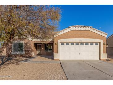 One-story house with a two-car garage and desert landscaping at 13407 N Primrose St, El Mirage, AZ 85335