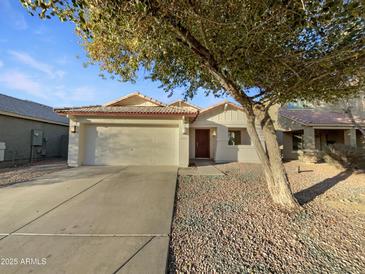 House exterior with two-car garage and landscaped yard at 1642 W La Salle St, Phoenix, AZ 85041