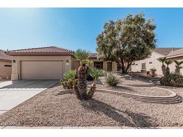 Single-story home with desert landscaping and a two-car garage at 18132 N Villa Bella Dr, Surprise, AZ 85374