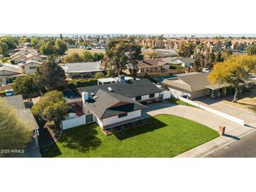 Aerial view of single-story home with spacious backyard and surrounding neighborhood at 1825 W Seldon Way, Phoenix, AZ 85021