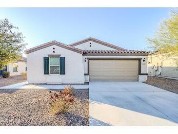 New single-story home with two-car garage and landscaped front yard at 25565 W Gwen St, Buckeye, AZ 85326