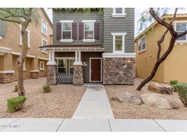 Two-story house with stone accents and a front porch at 34619 N 30Th Ave, Phoenix, AZ 85086