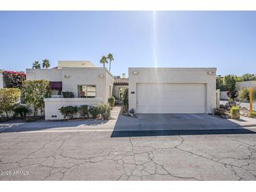 Front view of single-story home with attached garage and landscaping at 4701 E Ardmore Rd, Phoenix, AZ 85044