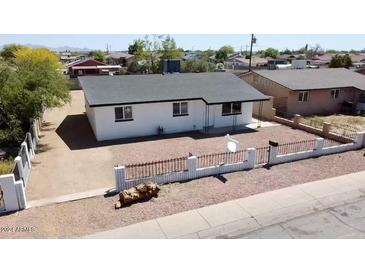 Newly renovated house with a fenced yard and a spacious front at 11713 W River Rd, El Mirage, AZ 85335