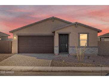 Charming single-story home featuring a brick driveway and a two-car garage at 4287 W Jeanette Ln, San Tan Valley, AZ 85144