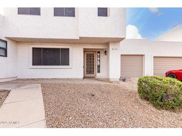 Two-story stucco home with attached garage and landscaped front yard at 2535 W Canyon Crest Cir, Phoenix, AZ 85023