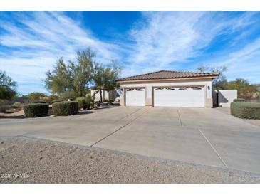 Two-story home with attached garage and desert landscaping at 26846 N 73Rd St, Scottsdale, AZ 85266