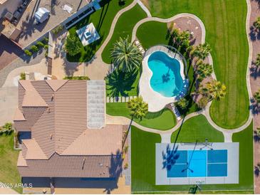 Aerial view of house, pool, and expansive backyard with sports court at 356 W Ivanhoe St, Gilbert, AZ 85233