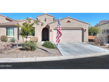 Single-story home with two-car garage and landscaped front yard at 5845 N Turquoise Ln, Eloy, AZ 85131