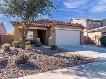 Single-story home with desert landscaping and two-car garage at 741 W Harvest Rd, San Tan Valley, AZ 85140