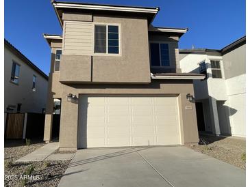 Two-story house with attached garage and neutral color scheme at 9358 E Sequence Ave, Mesa, AZ 85212