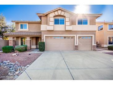 Two-story house with a large driveway and landscaping at 2977 E Teakwood Pl, Chandler, AZ 85249