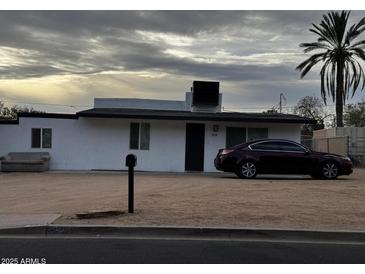 Charming single-story home featuring a mailbox, a parked car, and desert landscaping at 9618 N 9Th Ave, Phoenix, AZ 85021