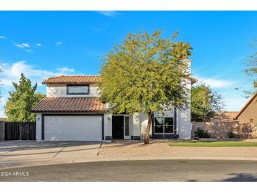 Two-story house with a white exterior, attached garage, and landscaping at 1126 E San Remo Ave, Gilbert, AZ 85234