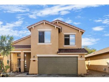 Charming two-story home with a well-maintained front yard and attached two-car garage at 2119 W Vineyard Plains Dr, San Tan Valley, AZ 85144