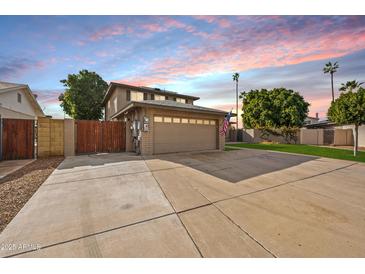 Two-story house with a gated driveway and attached garage at 2238 S Estrella Cir, Mesa, AZ 85202