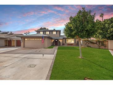 Two-story house with a landscaped lawn and attached garage at 2238 S Estrella Cir, Mesa, AZ 85202