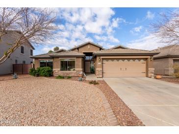 Single-story home with desert landscaping and two-car garage at 29590 N Balmoral Pl, San Tan Valley, AZ 85143