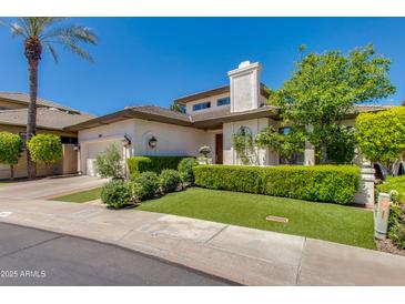 Beautiful home exterior with manicured landscaping and a two-car garage at 3047 E Marshall Ave, Phoenix, AZ 85016