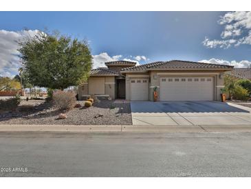 Single-story home with two-car garage and desert landscaping at 5251 W Posse Dr, Eloy, AZ 85131