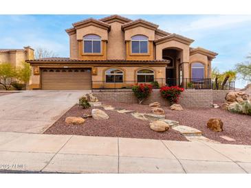 Two story home with landscaped yard and driveway at 14829 N 18Th Pl, Phoenix, AZ 85022