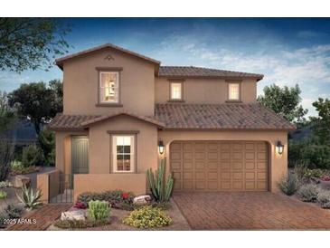 Two-story house with a brown facade, brick driveway, and desert landscaping at 21408 E Sparrow Dr, Queen Creek, AZ 85142
