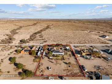 Aerial view of a large property with a house and surrounding land at 31637 W Grant St, Buckeye, AZ 85326