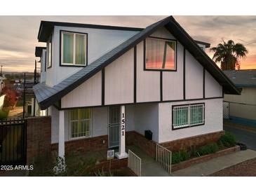 Attractive two-story home with a gray roof and white exterior at 1521 W Garfield St, Phoenix, AZ 85007