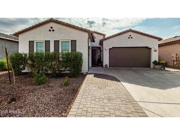 One-story home with two-car garage and landscaped front yard at 2963 E Birdsong Ave, San Tan Valley, AZ 85143