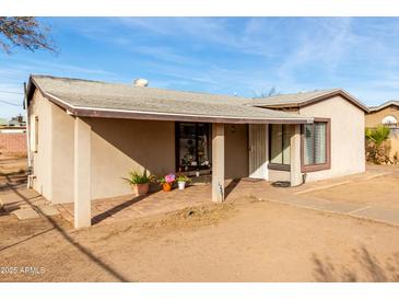 Ranch style home with front porch and mature landscaping at 3640 W Garfield St, Phoenix, AZ 85009