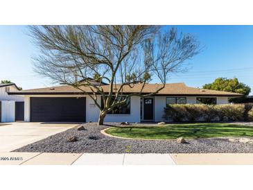 Ranch style home with modern updates, landscaping, and a two-car garage at 5414 N 82Nd St, Scottsdale, AZ 85250