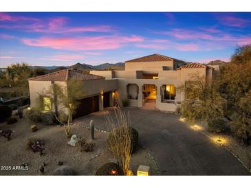 Beautiful desert home with a long driveway and landscaping at 10874 E Dale Ln, Scottsdale, AZ 85262