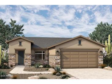 Single-story home with stone accents and a two-car garage at 19315 W Luke Ave, Litchfield Park, AZ 85340