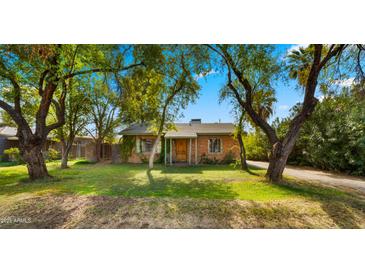 Brick home with mature trees and a spacious lawn at 2533 E Cheery Lynn Rd, Phoenix, AZ 85016