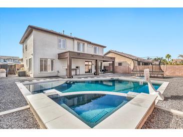 Inviting backyard oasis featuring a sparkling pool and spa at 4364 E Turnberry Ct, Gilbert, AZ 85298