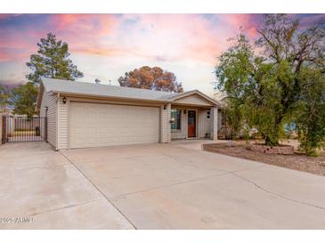 House exterior featuring a two-car garage and well-maintained landscaping at 5343 S El Camino Dr, Tempe, AZ 85283