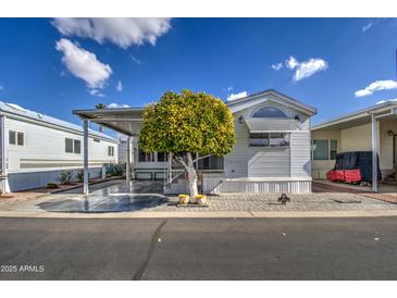 Nice manufactured home with carport and landscaping at 7750 E Broadway Rd # 83, Mesa, AZ 85208