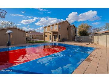 Home with large backyard, basketball court, and covered patio at 909 W Elm Ave, Coolidge, AZ 85128