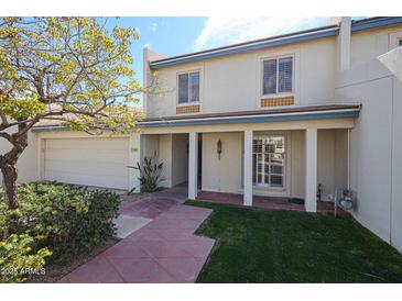 Charming two-story home with attached garage, manicured lawn, and covered porch at 5306 N 20Th St, Phoenix, AZ 85016