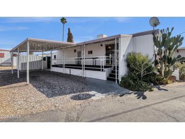 Mobile home with covered patio and carport at 5933 E Main St # 47, Mesa, AZ 85206