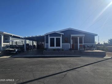 Single-story home with carport and landscaped yard at 650 N Hawes Rd # 2709, Mesa, AZ 85207