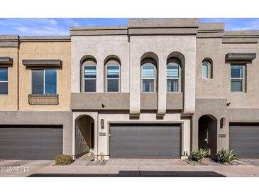 Modern 2-story townhome with attached garage and landscaped front yard at 7460 E Via De Luna Dr, Scottsdale, AZ 85255