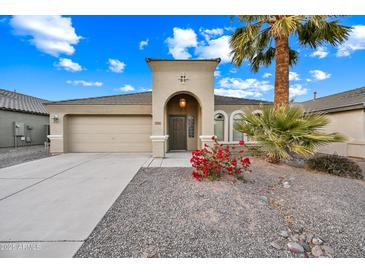 One-story house with a two-car garage and desert landscaping at 20 W Cooper Canyon Rd, San Tan Valley, AZ 85143