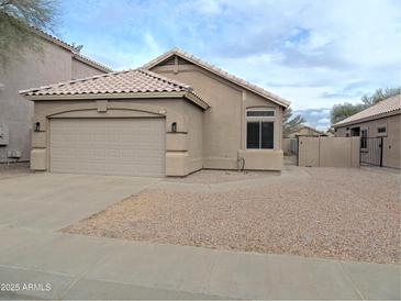 One-story house with attached garage and gravel driveway at 4330 E South Fork Dr, Phoenix, AZ 85044