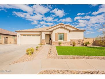 One-story home with attached garage and landscaped front yard at 22282 E Tierra Grande Ct, Queen Creek, AZ 85142