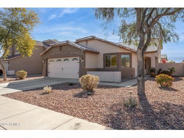 One-story home with stone accents and a two-car garage at 24833 W Jessica Ln, Buckeye, AZ 85326